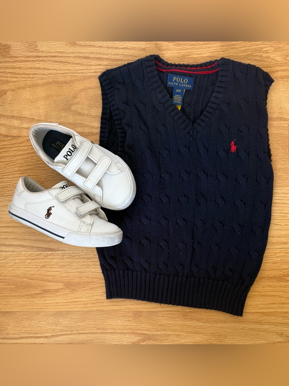 Polo by Ralph Lauren Navy Cable-Knit V-Neck Sweater Vest and Polo Sneakers.